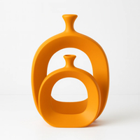 گلدان-سرامیکی-مدرن-طرح-دونات-نارنجی-مات-200